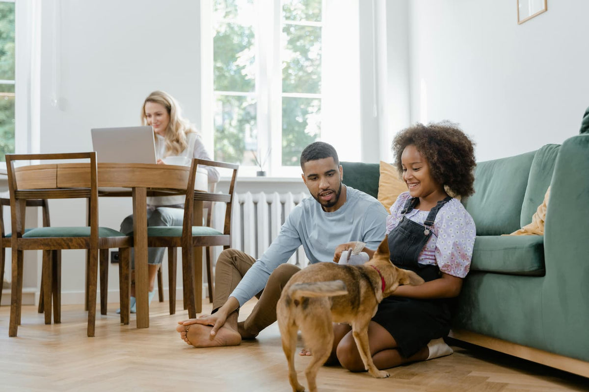 family in house with happy dog